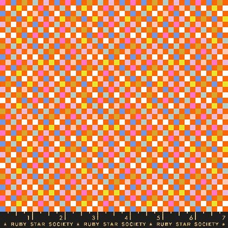 The image is a vibrant and colorful pattern composed of numerous small squares in various shades of orange, pink, yellow, and blue. The pattern appears to be a mosaic or a repeating design, creating a visually striking and dynamic composition.