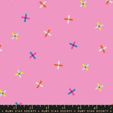 a pattern of colorful crosses on a pink background.