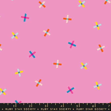 a pattern of colorful crosses on a pink background.