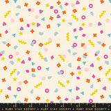 The image is a vibrant and playful collage of various colorful shapes and patterns, including stars, hearts, and geometric designs, scattered across a light background.