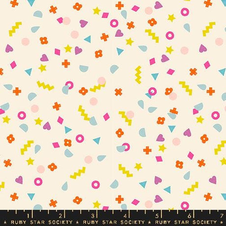 The image is a vibrant and playful collage of various colorful shapes and patterns, including stars, hearts, and geometric designs, scattered across a light background.