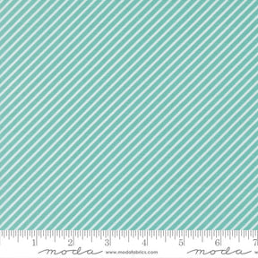 a fabric with a diagonal striped pattern in shades of green and white. The fabric appears to be a textile or material with a repeating diagonal pattern.