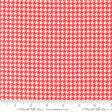 a red and white patterned fabric with a repeating geometric design.