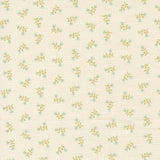 a repeating pattern of small green flowers on a light beige background.
