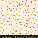 The image is a vibrant and playful collage of various colorful shapes and patterns, including stars, hearts, and geometric designs, scattered across a light background.