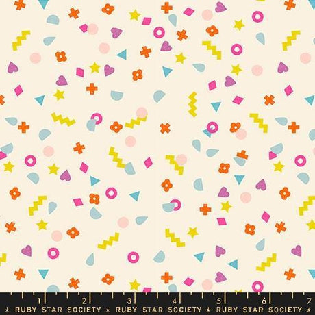 The image is a vibrant and playful collage of various colorful shapes and patterns, including stars, hearts, and geometric designs, scattered across a light background.