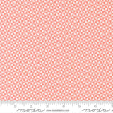 a repeating pattern of pink triangles on a fabric surface.