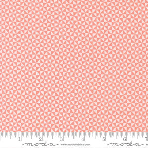 a repeating pattern of pink triangles on a fabric surface.