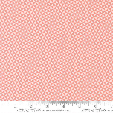 a repeating pattern of pink triangles on a fabric surface.