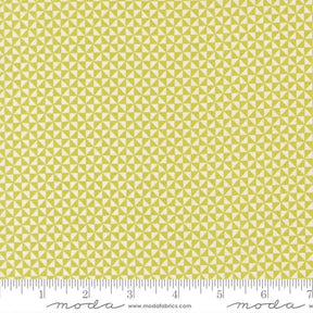 a repeating pattern of yellow triangles on a fabric surface.