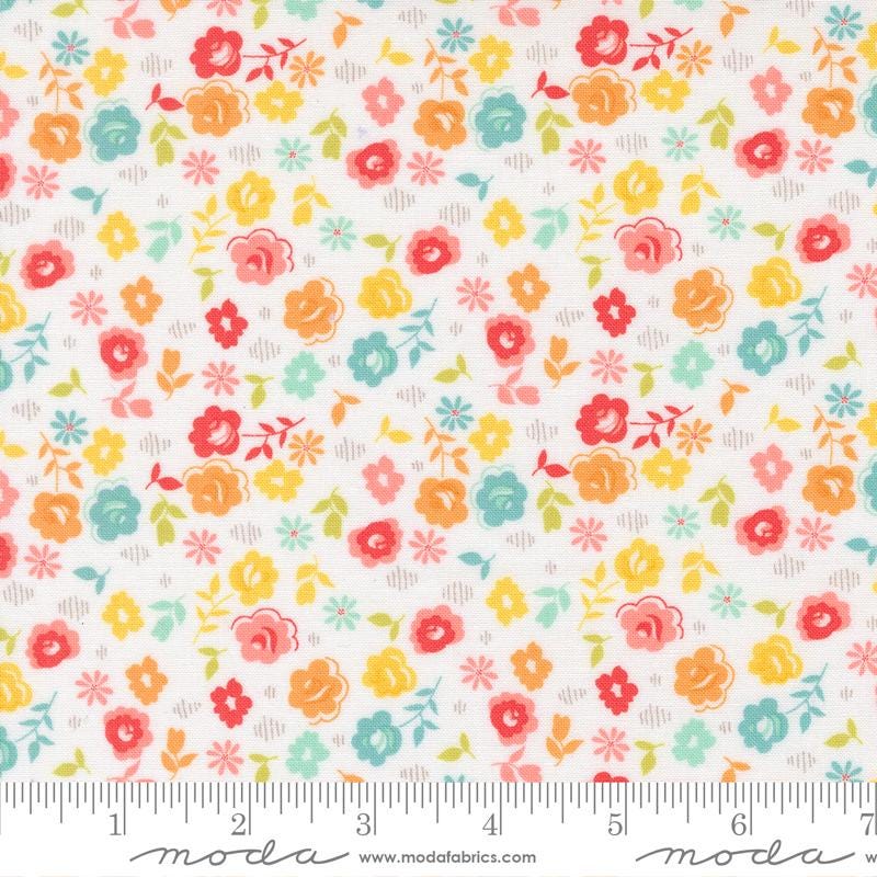 The image is a fabric with a floral pattern, featuring various colorful flowers and leaves in different shades of orange, yellow, green, and pink. The fabric appears to be a soft, pastel-colored material, suitable for sewing or other textile applications.