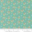 a fabric with a floral pattern in shades of green and pink. The pattern consists of small flowers and leaves scattered across the fabric, creating a vibrant and colorful design.