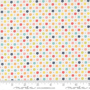 The image is a fabric with a repeating pattern of small flowers in various colors, including red, yellow, green, blue, and orange. The pattern is arranged in a diagonal direction, creating a visually appealing and vibrant design.