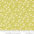 a fabric with a repeating pattern of white flowers on a yellow background. The fabric appears to be a fabric with a floral print, and it is displayed on a ruler for size reference.