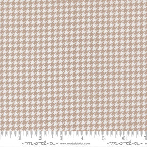 a repeating pattern of brown and white houndstooth designs, creating a visually appealing and intricate pattern.