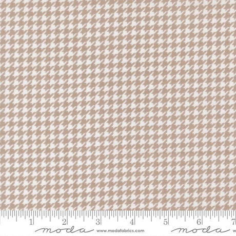 a repeating pattern of brown and white houndstooth designs, creating a visually appealing and intricate pattern.