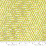 a repeating pattern of small white flowers on a yellow background.
