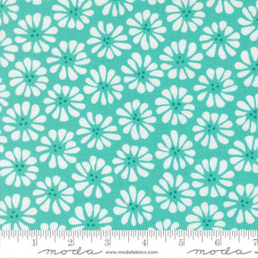 a repeating pattern of white flowers with green centers against a turquoise background.