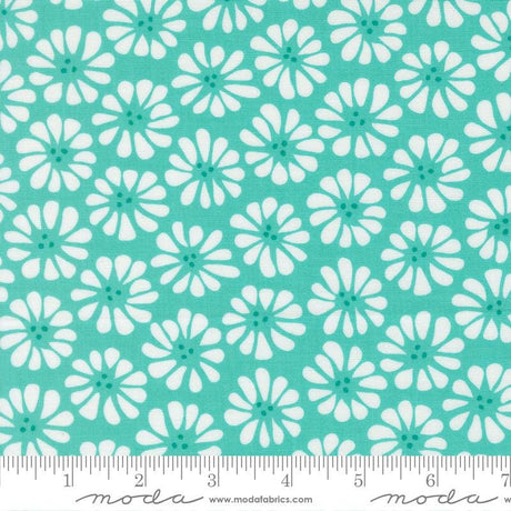 a repeating pattern of white flowers with green centers against a turquoise background.