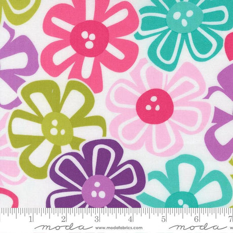 The image is a close-up of a fabric with a repeating pattern of colorful flowers in shades of pink, green, purple, and blue.