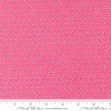 The image is a close-up of a fabric with a pink floral pattern.