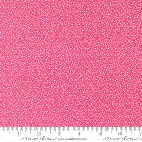 The image is a close-up of a fabric with a pink floral pattern.