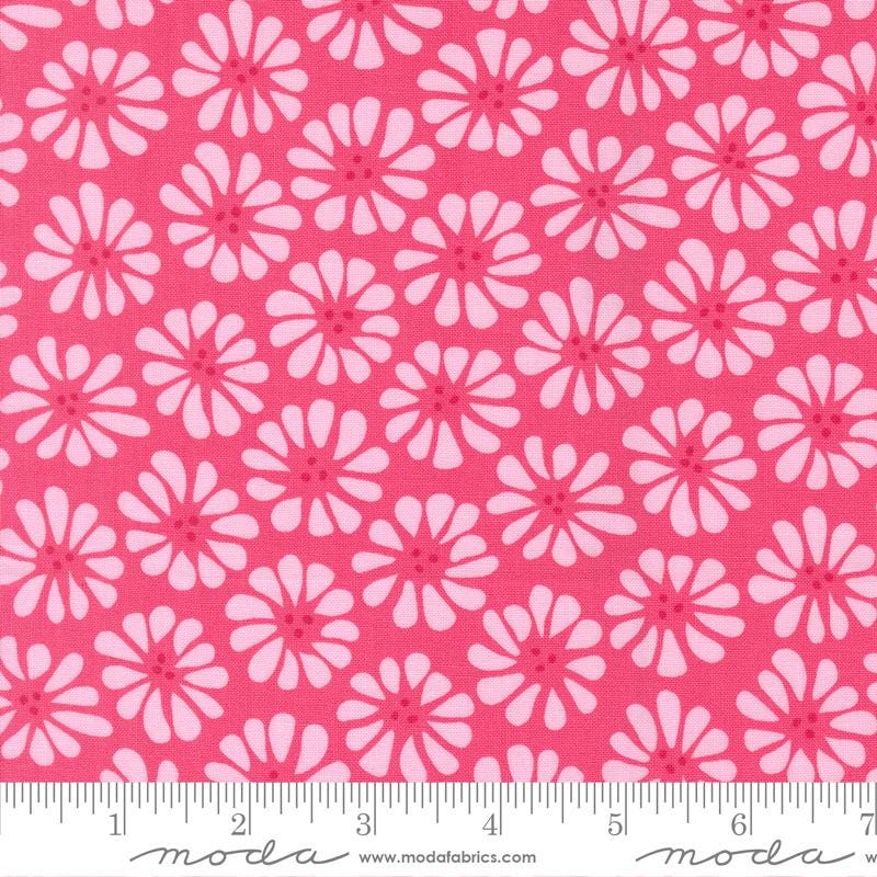a repeating pattern of pink flowers on a red background.