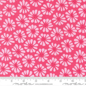 a repeating pattern of pink flowers on a red background.