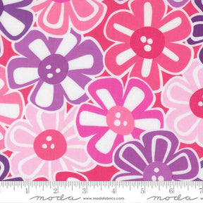 The image is a close-up of a fabric with a repeating pattern of colorful flowers in shades of pink, purple, and white.