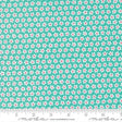 a fabric with a repeating pattern of white and pink flowers on a turquoise background. The fabric appears to be a textile or material with a floral design.