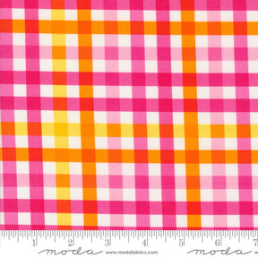 The image is a close-up of a fabric with a checkered pattern in shades of pink, orange, and yellow.