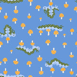 a pattern of whimsical caterpillars and mushrooms against a blue background.