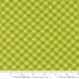 a close-up view of a fabric with a diagonal green and yellow checkered pattern.