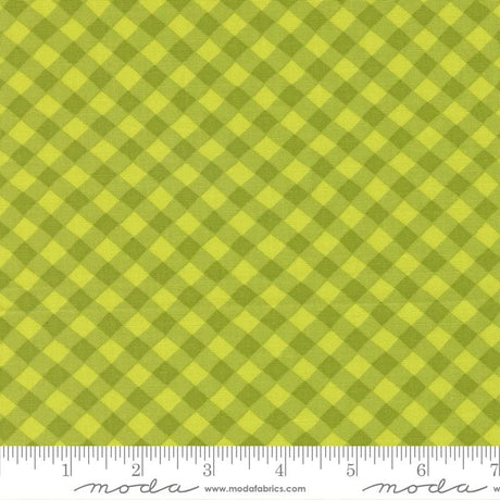 a close-up view of a fabric with a diagonal green and yellow checkered pattern.