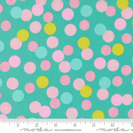 The image is a fabric with a pattern of multicolored polka dots in various shades of pink, yellow, and green. The pattern is scattered across the fabric, creating a vibrant and playful design.