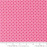 a fabric with a repeating pattern of pink and white circles, creating a visually striking and vibrant design.