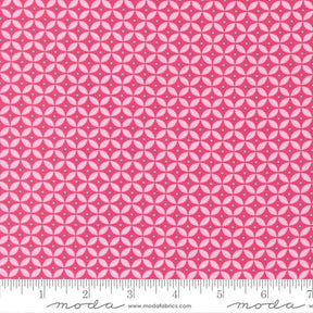 a fabric with a repeating pattern of pink and white circles, creating a visually striking and vibrant design.