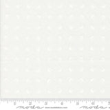 The image is a plain white fabric with a repeating pattern of circles or dots. There is a ruler at the bottom of the image for scale.