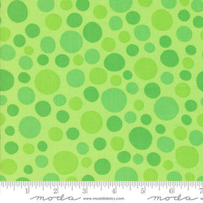 The image is a fabric with a green polka dot pattern.