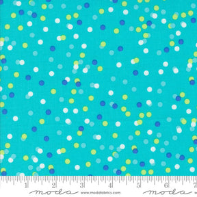 The image is a close-up of a fabric with a pattern of multicolored dots on a turquoise background.