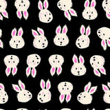 a repeating pattern of stylized white rabbit faces against a black background.