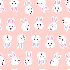 a repeating pattern of white bunny faces on a pink background.