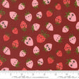 a pattern of pink and red strawberries with faces on a dark red background.
