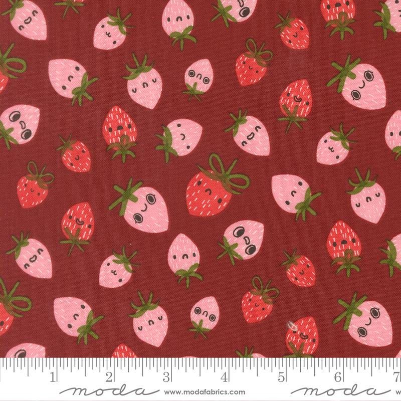 a pattern of pink and red strawberries with faces on a dark red background.
