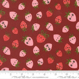 a pattern of pink and red strawberries with faces on a dark red background.