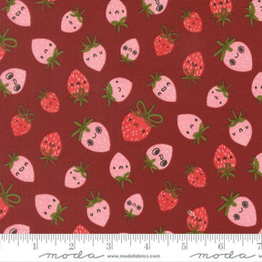 a pattern of pink and red strawberries with faces on a dark red background.