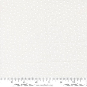 The image is a fabric with a white polka dot pattern.