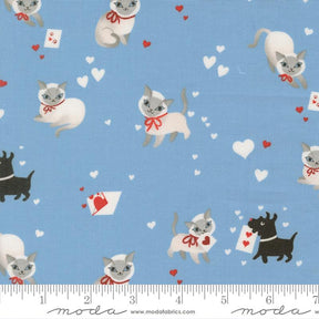 a repeating pattern of cats and dogs against a blue background, with hearts scattered throughout the scene.