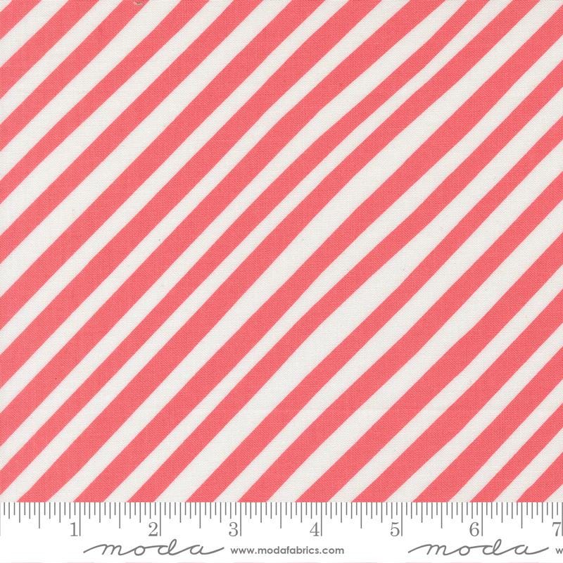a close-up view of a fabric with diagonal red and white stripes.