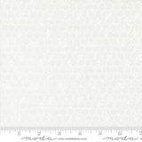 The image is a close-up of a white fabric with a honeycomb pattern.